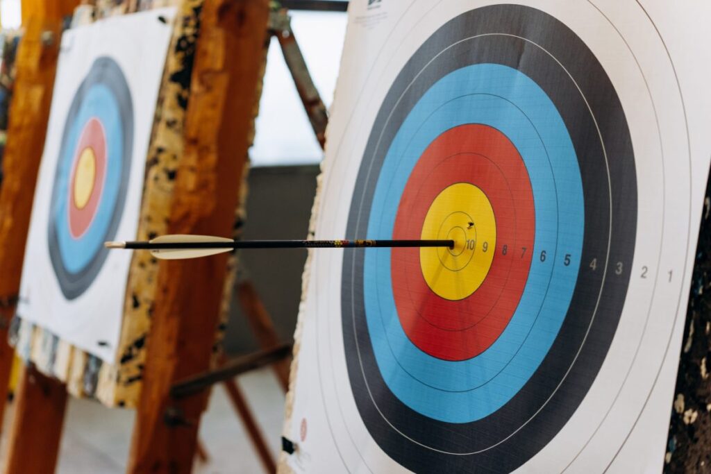 Archers participating in Juwai Teer Game aiming for the target.